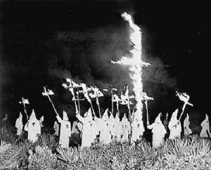 Ku Klux Klan burning a cross.