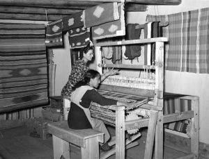 Spanish-American woman working for the WPA weaving a rag rug at Costilla, New Mexico by Russell Lee, 1939.